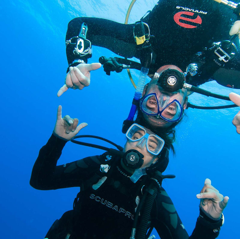 two divers happy underwater