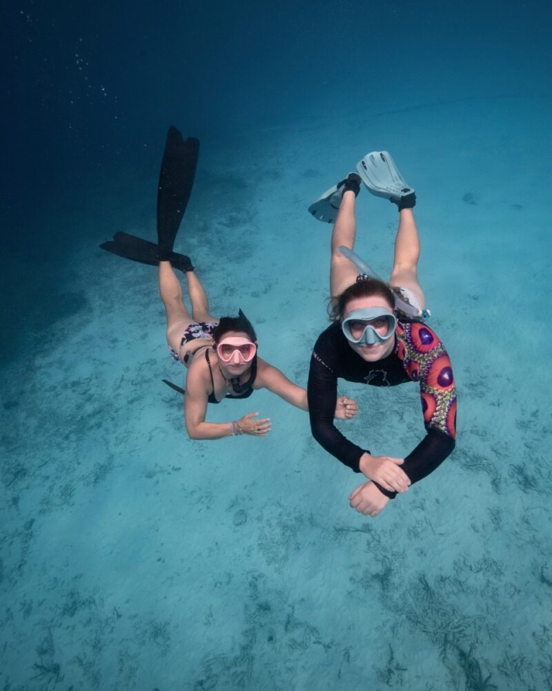 Two Women Freediving at Klein Curacao